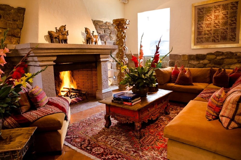 Lounge with fireplace at Inkaterra La Casona