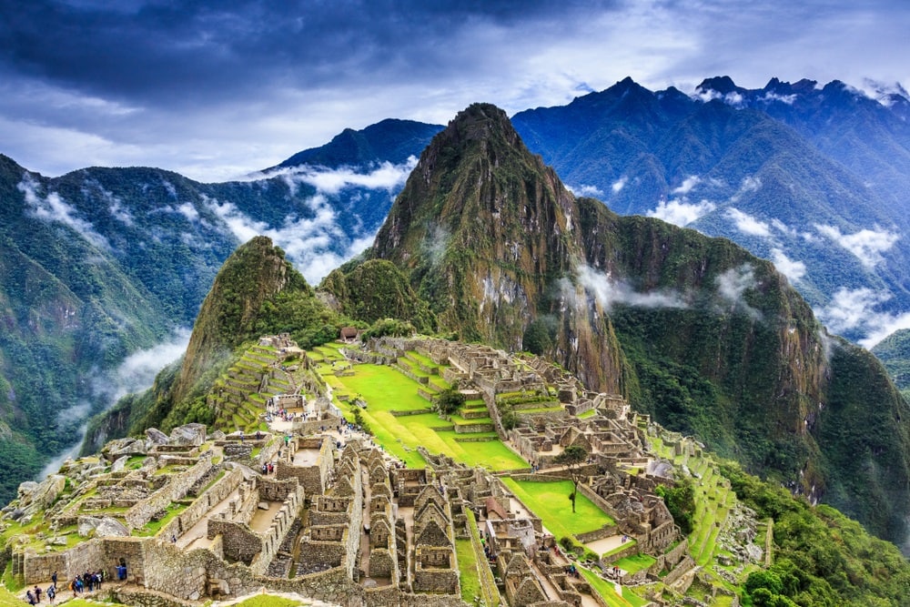 panoramic picture of Machu Picchu with moody blue sky in the back ground