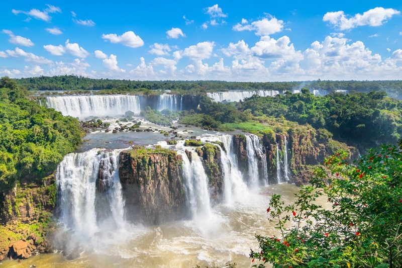 panoramic view of Iguazu Falls on a bright summers day
