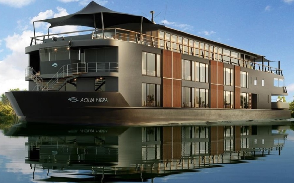 Aqua Nera - Modern Amazon River Boat in dark brown wooden colors.