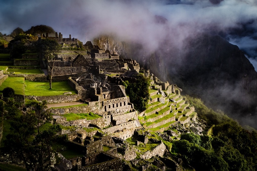 Panormaic view of Machu Picchu, misty and moody dark scene