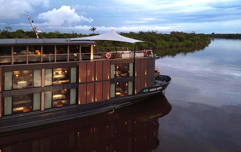 Aqua Nera Luxury Amazon River Cruise Boat at dusk on the river